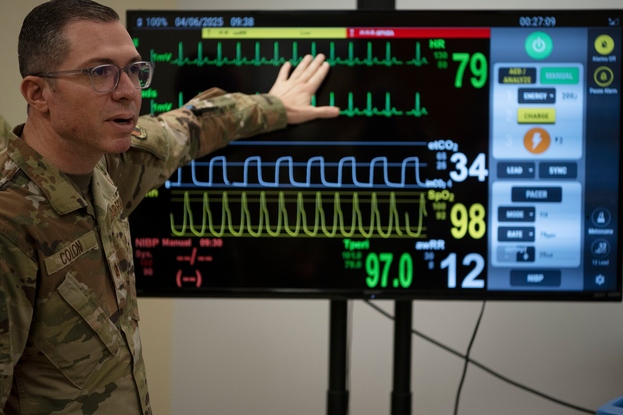 U.S. Air Force Maj. Ismael Colon, flight surgeon, 156th Medical Group, Detachment 1, Puerto Rico Air National Guard, explains the patient's vital readings during the medical group trauma training simulator lab inauguration at Muñiz Air National Guard Base, Carolina, Puerto Rico, April 6, 2025. The inauguration was conducted by demonstrating the lab's capabilities to 156th Wing leadership and Puerto Rico state guard air members as part of the third phase of a five-phase medical modernization project valued at approximately $160k. (U.S. Air National Guard photo by Master Sgt. Rafael D. Rosa)