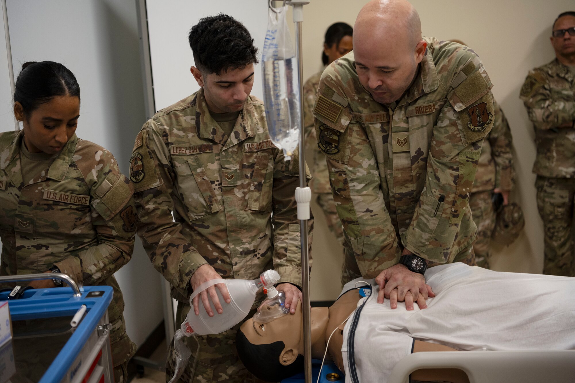 U.S. Airmen assigned to the 156th Medical Group, Detachment 1, Puerto Rico Air National Guard, respond to an emergency scenario with the SimMan 3G Plus mannequin during the medical group trauma training simulator lab inauguration at Muñiz Air National Guard Base, Carolina, Puerto Rico, April 6, 2025. The inauguration was conducted by demonstrating the lab's capabilities to 156th Wing leadership and Puerto Rico state guard air members as part of the third phase of a five-phase medical modernization project valued at approximately $160k. (U.S. Air National Guard photo by Master Sgt. Rafael D. Rosa)