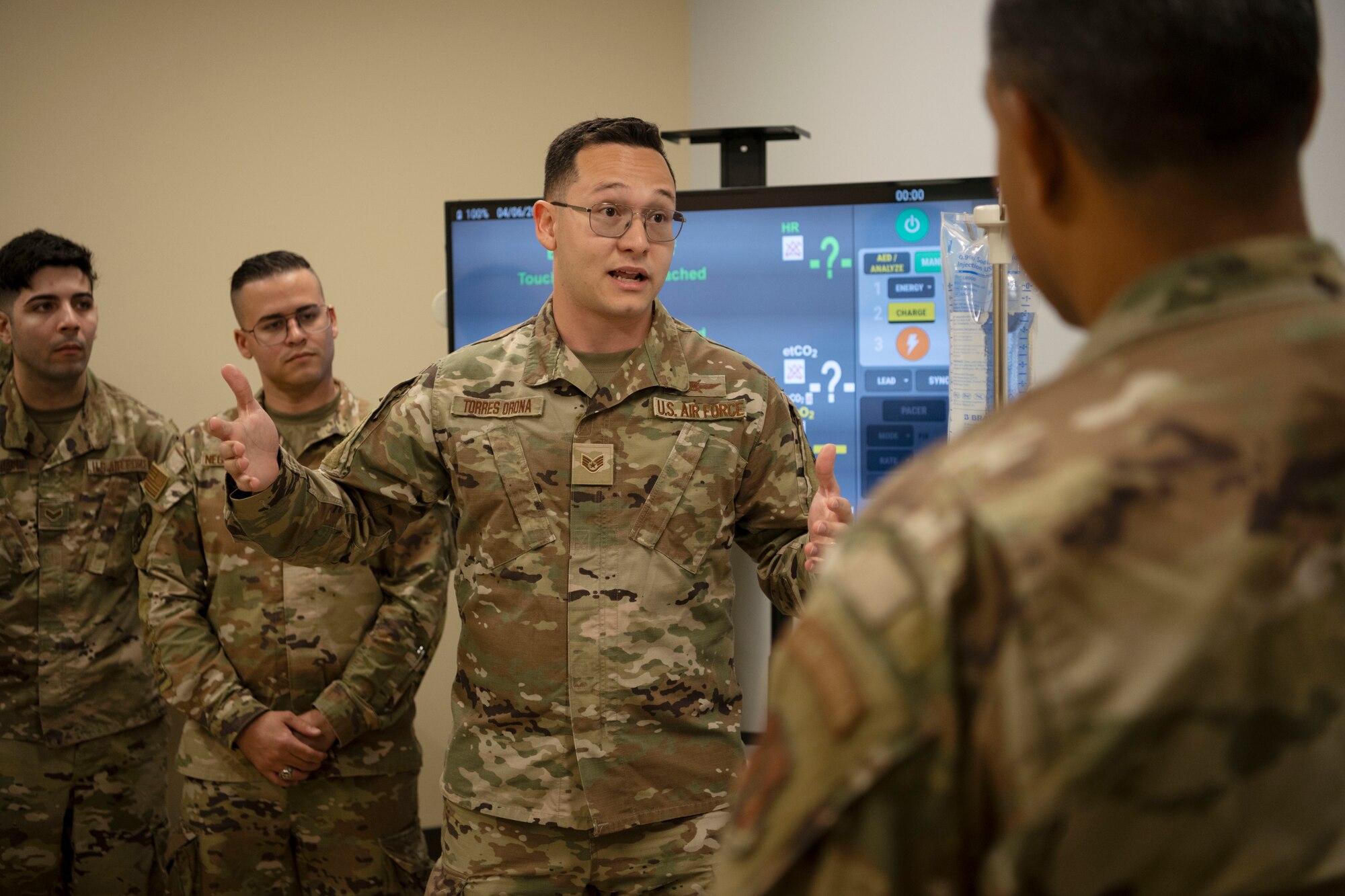 U.S. Air Force Staff Sgt. Carlos Torres, respiratory therapist, 156th Medical Group, Detachment 1, Puerto Rico Air National Guard, speaks during the medical group trauma training simulator lab inauguration at Muñiz Air National Guard Base, Carolina, Puerto Rico, April 6, 2025. The inauguration was conducted by demonstrating the lab's capabilities to 156th Wing leadership and Puerto Rico state guard air members as part of the third phase of a five-phase medical modernization project valued at approximately $160k. (U.S. Air National Guard photo by Master Sgt. Rafael D. Rosa)