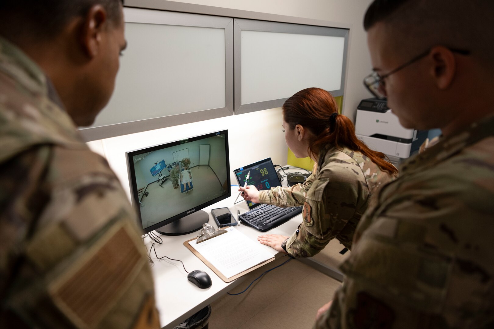 U.S. Air Force 2nd Lt. Adliana Martinez, clinical nurse, 156th Medical Group, Detachment 1, Puerto Rico Air National Guard, demonstrates the the instructor tablet and monitor to Col. Evaristo Orengo, commander, 156th Wing, during the medical group trauma training simulator lab inauguration at Muñiz Air National Guard Base, Carolina, Puerto Rico, April 6, 2025. The inauguration was conducted by demonstrating the lab's capabilities to 156th Wing leadership and Puerto Rico state guard air members as part of the third phase of a five-phase medical modernization project valued at approximately $160k. (U.S. Air National Guard photo by Master Sgt. Rafael D. Rosa)