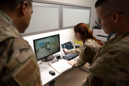 U.S. Air Force 2nd Lt. Adliana Martinez, clinical nurse, 156th Medical Group, Detachment 1, Puerto Rico Air National Guard, demonstrates the the instructor tablet and monitor to Col. Evaristo Orengo, commander, 156th Wing, during the medical group trauma training simulator lab inauguration at Muñiz Air National Guard Base, Carolina, Puerto Rico, April 6, 2025. The inauguration was conducted by demonstrating the lab's capabilities to 156th Wing leadership and Puerto Rico state guard air members as part of the third phase of a five-phase medical modernization project valued at approximately $160k. (U.S. Air National Guard photo by Master Sgt. Rafael D. Rosa)