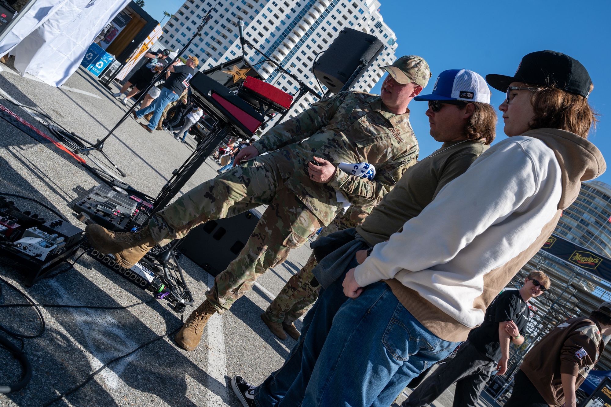 U.S. Air Force Master Sgt. Mike Wittrien, the noncommissioned officer in charge and bassist with The U.S. Air Force Band’s Max Impact, connects with audience members during the Southern California tour at a Formula Drift event, Long Beach, Calif., April 5, 2025. The mission of Max Impact, a rock band, is to honor those who have served, inspire American citizens to heightened patriotism and service, and connect the global community on behalf of the Air Force and the United States. Max Impact consists of six active-duty musicians stationed at Joint Base Anacostia-Bolling, Washington, D.C. (U.S. Air Force photo by Hayden Hallman)
