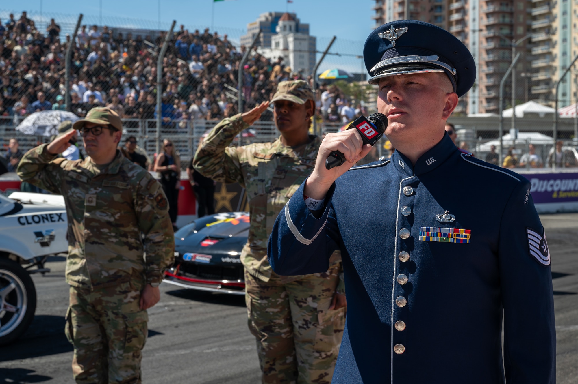 U.S. Air Force Tech. Sgt. Benton Felty, a vocalist with The U.S. Air Force Band’s Max Impact, sings “The Star-Spangled Banner” during the Southern California tour at a Formula Drift event, Long Beach, Calif., April 5, 2025. Max Impact partnered with Air Force Recruiting Service to perform and sing the national anthem at the event. Max Impact consists of six active-duty musicians stationed at Joint Base Anacostia-Bolling, Washington, D.C. (U.S. Air Force photo by Hayden Hallman)
