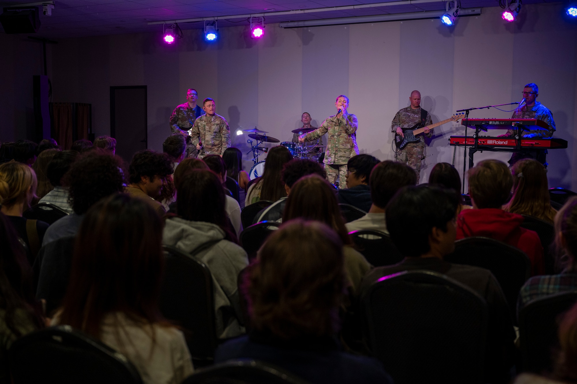 Members of The U.S. Air Force Band's Max Impact perform to an audience of students during the Max Impact Southern California tour at Orange County School of the Arts, Santa Ana, Calif., April 7, 2025. The mission of Max Impact, a rock band, is to honor those who have served, inspire American citizens to heightened patriotism and service, and connect the global community on behalf of the Air Force and the United States. Max Impact consists of six active-duty musicians stationed at Joint Base Anacostia-Bolling, Washington, D.C. (U.S. Air Force photo by Hayden Hallman)