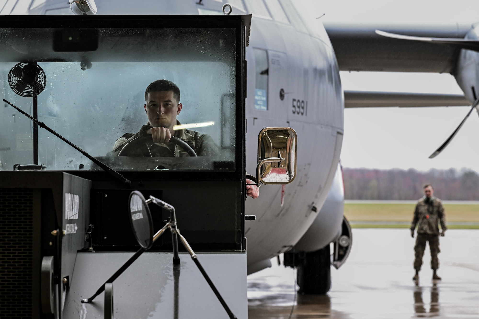 Tech. Sgt. Creston Shirey, an aircraft maintenance craftsman, tows a C-130J-30 Super Hercules on the flightline at Youngstown Air Reserve Station, Ohio, April 6, 2025.