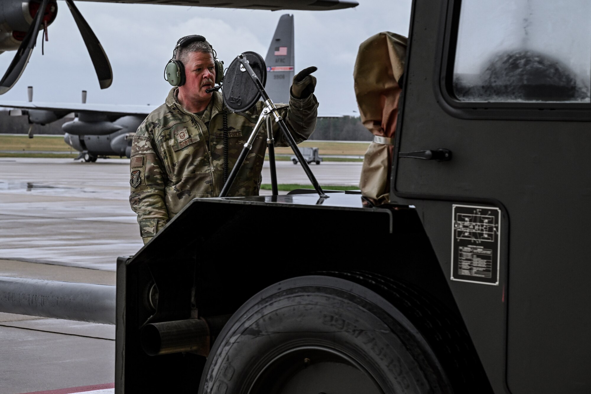 Master Sgt. Dan Scott, a dedicated crew chief, assists in towing a C-130J-30 Super Hercules on the flightline at Youngstown Air Reserve Station, Ohio, April 6, 2025.