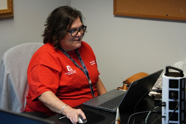 Margaret Draughn, a real estate specialist deployed to Asheville, North Carolina for Hurricane Helene response efforts, reviews Right of Entry forms from private property owners requesting government assistance for debris removal, April 10, 2025. These forms are essential for determining eligibility, verifying ownership and access, and authorizing crews to safely enter private property to clear storm debris. (U.S. Army Corps of Engineers photo by Michael Davis)
