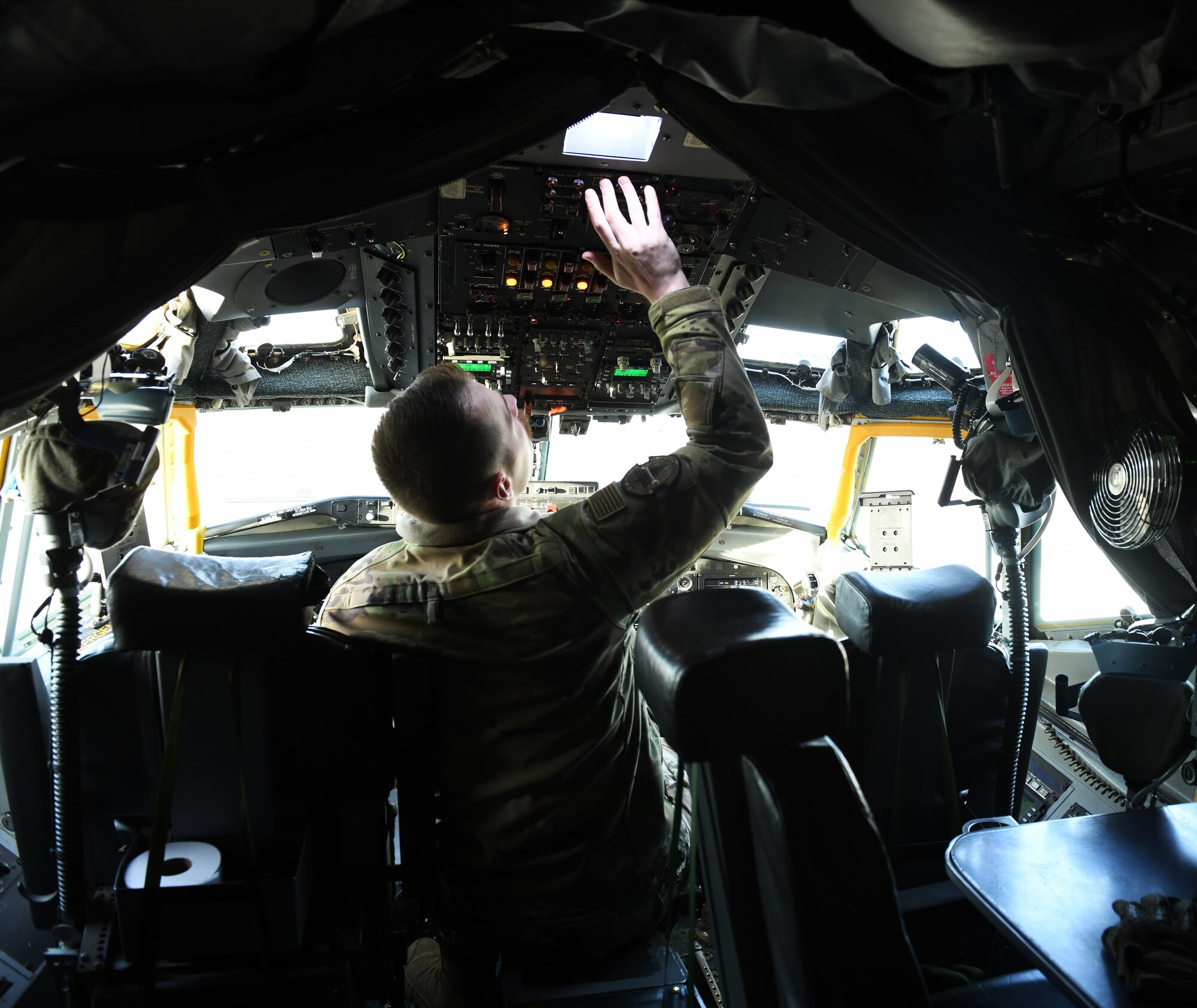 Airman does preflight checks inside of a RC-135 Rivet Joint aircraft.