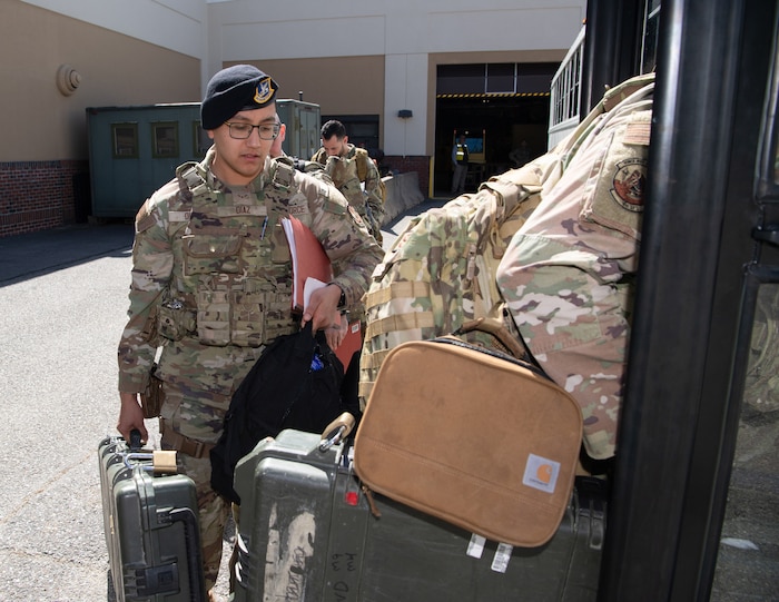 Image of Airmen getting into a bus.