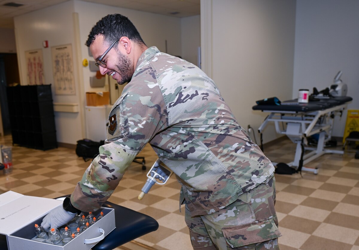 U.S. Air Force Senior Airman Christopher Neal, 42nd Medical Group physical medicine technician, grabs a massage cup at Maxwell Air Force Base, Alabama, April 8, 2025.