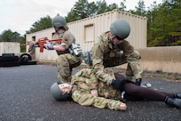 Airman applies a tornaquet.