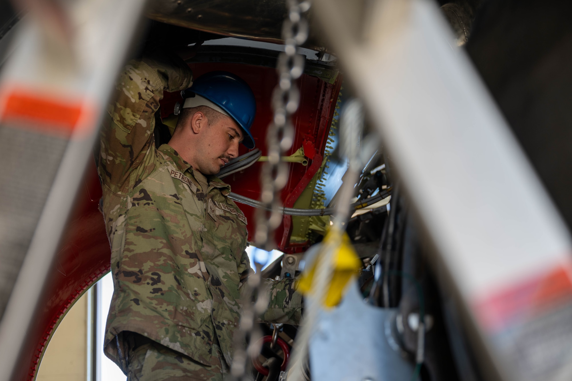 Senior Airman Dominic Petrone, 373rd Training Squadron Detachment 8 student, inspects the engine for a KC-46A Pegasus at McConnell Air Force Base, Kansas, April 10, 2025.