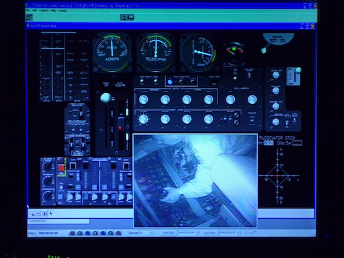 monitor display Col. John Poole’s view from inside the KC-135 Boom Pod Simulator during a refueling scenario.