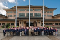 U.S. Air Force Maj. Gen. Joel Carey, chief of staff for U.S. Indo-Pacific Command, joins National Defense University Foreign Fellows for a group photo during their capstone event at USINDOPACOM headquarters on Camp H.M. Smith, Honolulu, April 10, 2025.
