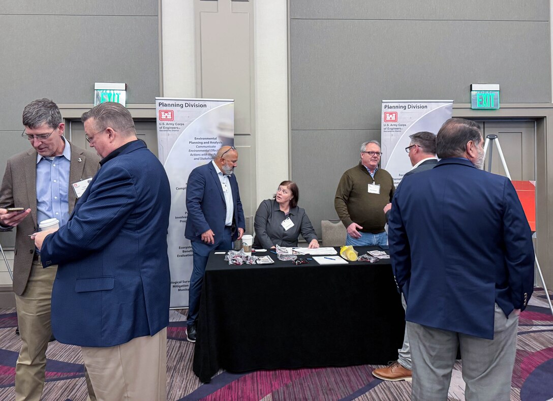 U.S. Army Corps of Engineers Sacramento District team members from the planning division speak with attendees at the annual Business Opportunity Open House hosted by the small business section at the Hyatt Regency in Sacramento, California on March 12, 2025. (U.S. Army photo by Bertha Smith, U.S. Army Corps of Engineers Sacramento District Public Affairs)