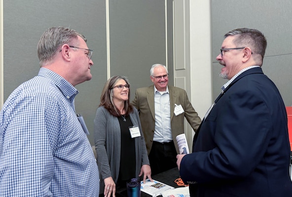 U.S. Army Corps of Engineers Sacramento District team members from the operations division speak with attendees at the annual Business Opportunity Open House hosted by the small business section at the Hyatt Regency in Sacramento, California on March 12, 2025. (U.S. Army photo by Bertha Smith, U.S. Army Corps of Engineers Sacramento District Public Affairs)