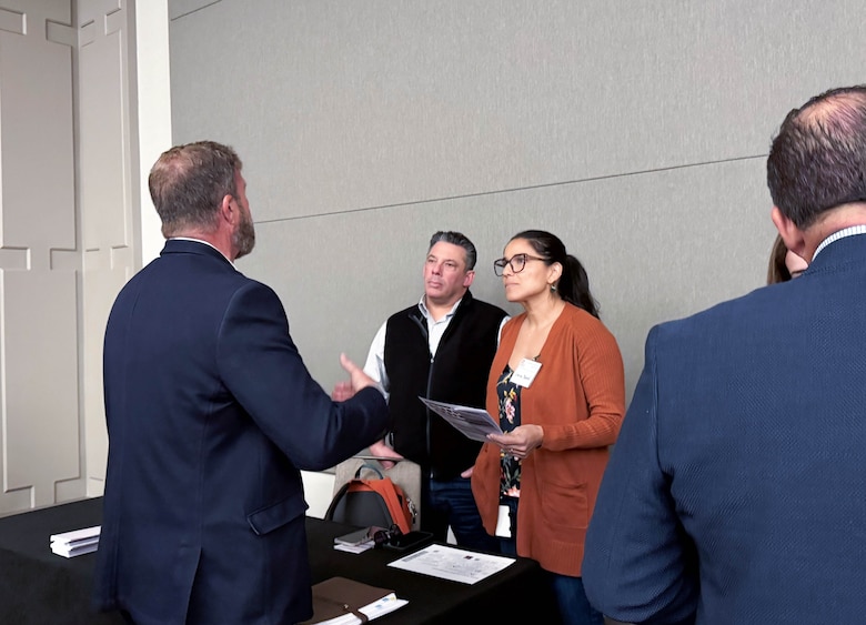 U.S. Army Corps of Engineers Sacramento District team members, Josh Garcia (left) and Larissa Boland (right) speak to an attendee at the annual Business Opportunity Open House hosted by the small business section at the Hyatt Regency in Sacramento, California on March 12, 2025. (U.S. Army photo by Bertha Smith, U.S. Army Corps of Engineers Sacramento District Public Affairs)