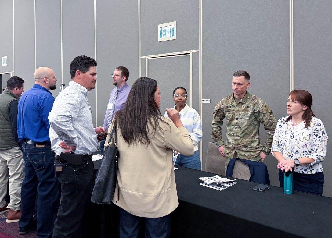 U.S. Army Corps of Engineers Sacramento District team Contracting Division members speak to an attendee at the annual Business Opportunity Open House hosted by the small business section at the Hyatt Regency in Sacramento, California on March 12, 2025. (U.S. Army photo by Bertha Smith, U.S. Army Corps of Engineers Sacramento District Public Affairs)
