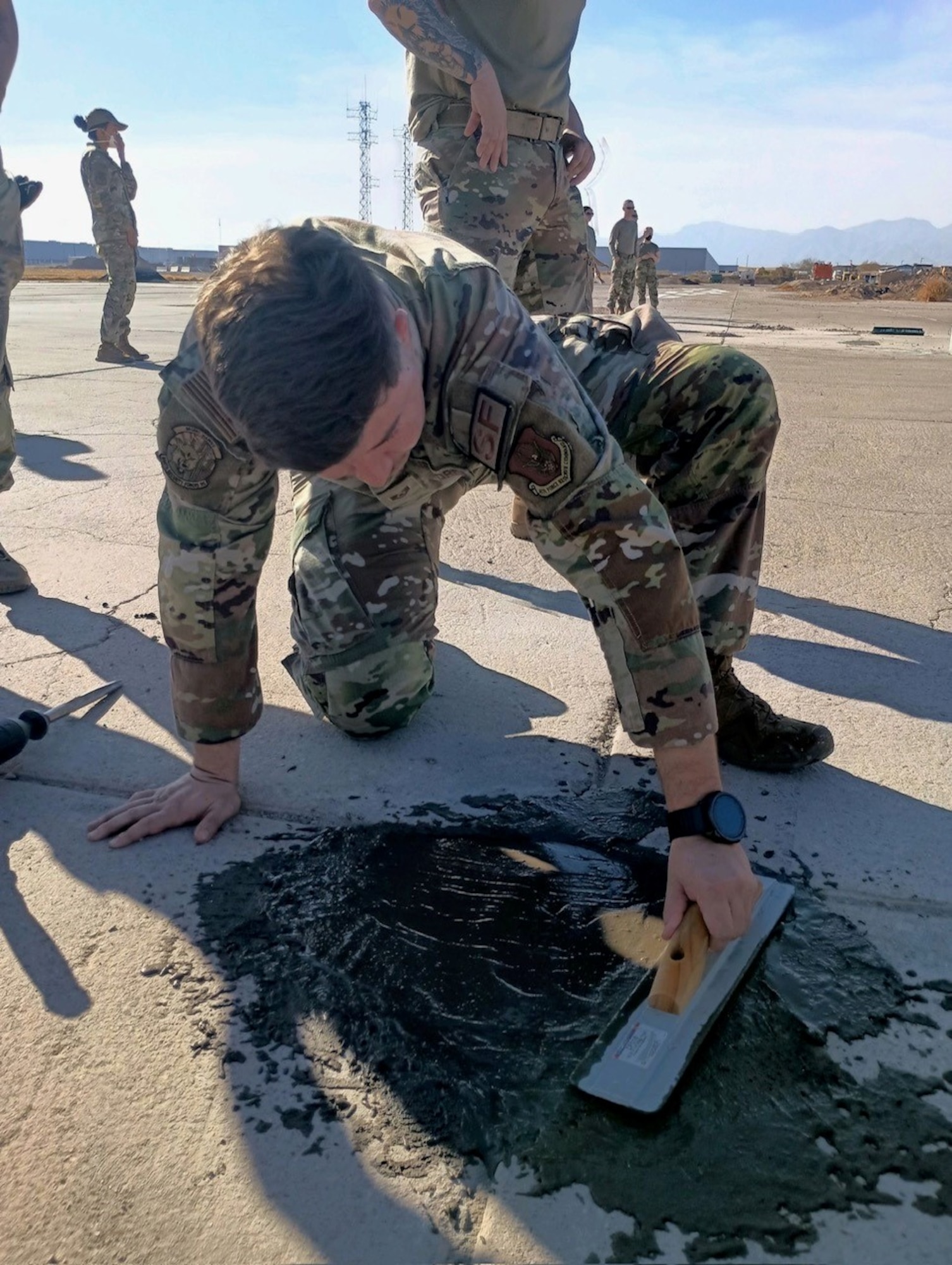 A U.S. Air Force Reserve Citizen Airman fill a crack with concrete  during runway repair training in 944th Fighter Wing’s Mission Ready Airman Academy at Luke Air Force Base, Ariz., Jan. 31, 2025. The academy earned the approval stamp to certify its course as an Advanced Ready Training Core by Air Education and Training Command making the 944th Fighter Wing the second wing in the Air Force to have a wing-level certified ART-CORE course. (U.S. Air Force photo)