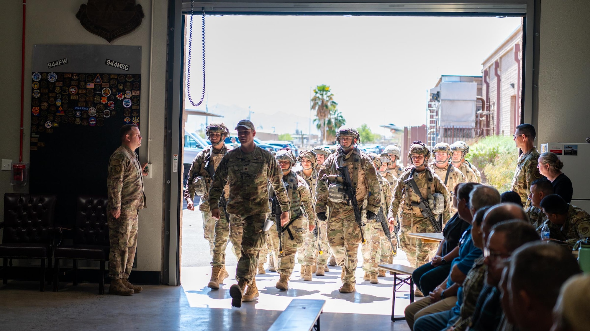 U.S. Air Force Reserve Citizen Airmen ruck into their graduation from the the 944th Fighter Wing’s Mission Ready Airman Academy at Luke Air Force Base, Ariz., April 6, 2025. The academy earned the approval stamp to certify its course as an Advanced Ready Training Core by Air Education and Training Command making the 944th Fighter Wing the second wing in the Air Force to have a wing-level certified ART-CORE course. (U.S. Air Force photo by SrA Jacob Dastas)