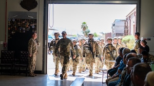 U.S. Air Force Reserve Citizen Airmen ruck into their graduation from the the 944th Fighter Wing’s Mission Ready Airman Academy at Luke Air Force Base, Ariz., April 6, 2025. The academy earned the approval stamp to certify its course as an Advanced Ready Training Core by Air Education and Training Command making the 944th Fighter Wing the second wing in the Air Force to have a wing-level certified ART-CORE course. (U.S. Air Force photo by SrA Jacob Dastas)