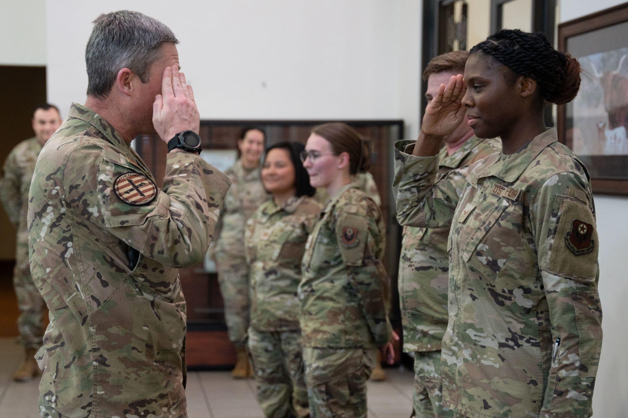 U.S. Air Force Lt. Gen. Michael Conley, commander of Air Force Special Operations Command, coins an Air Commando assigned to the 27th Special Operations Wing at Cannon Air Force Base, New Mexico.