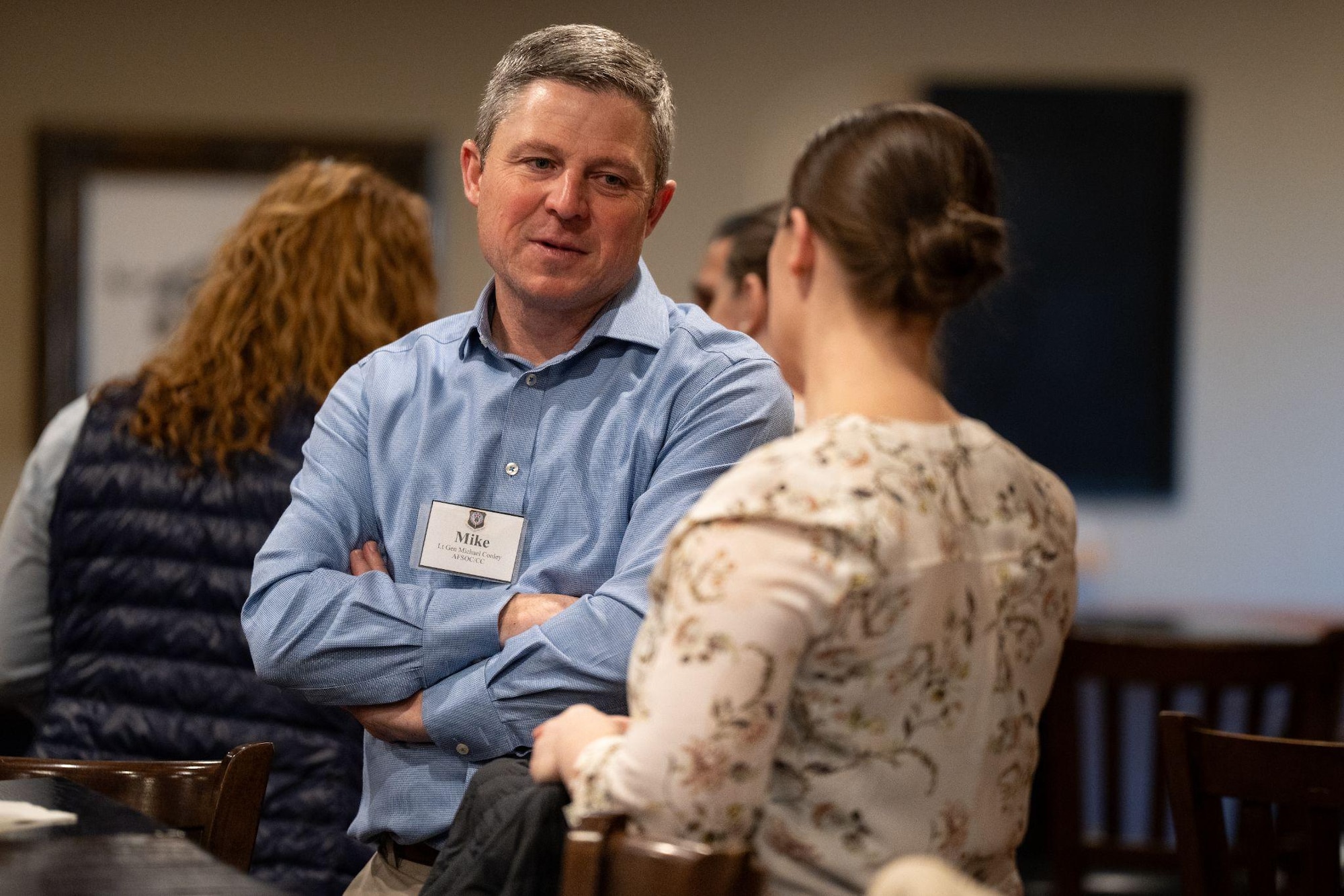 U.S. Air Force Lt. Gen. Michael Conley, commander of Command, talks with a member of the Squadron Leadership Course at Cannon Air Force Base, New Mexico.