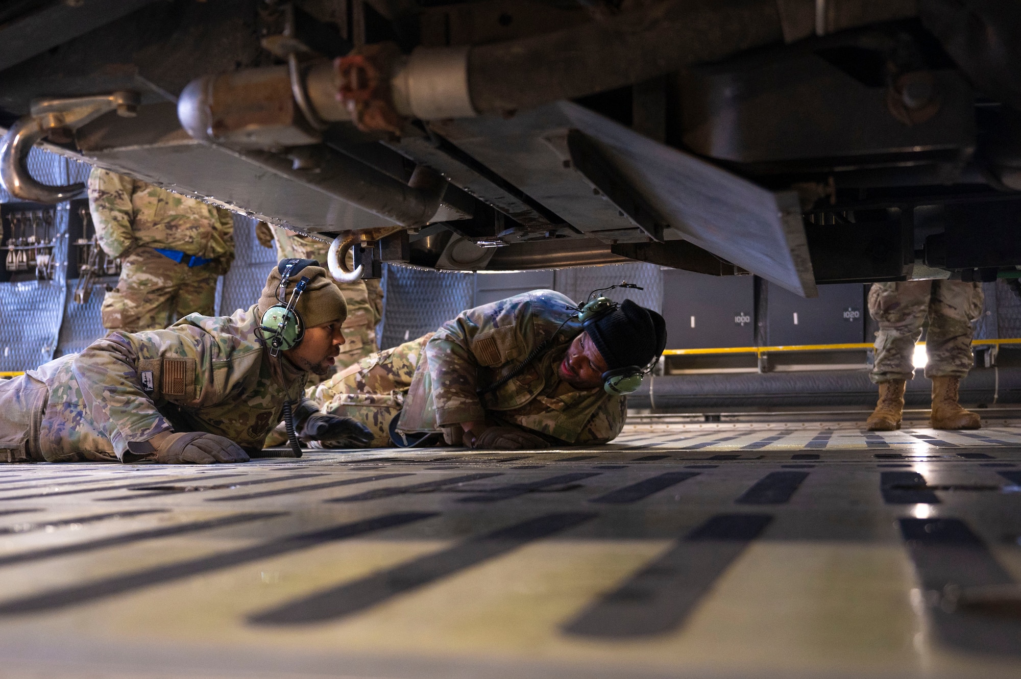 U.S. Air Force Airmen with the 62d Aerial Port Squadron, 446th APS and 709th Airlift Squadron from Dover Air Force Base, Delaware, load a fire truck onto a C-5M Super Galaxy at Joint Base Lewis-McChord, Washington, April 8, 2025. 
A donated fire truck arrived at JBLM via flatbed truck to be shipped to Guatemala in support of the Denton Humanitarian Assistance Program.