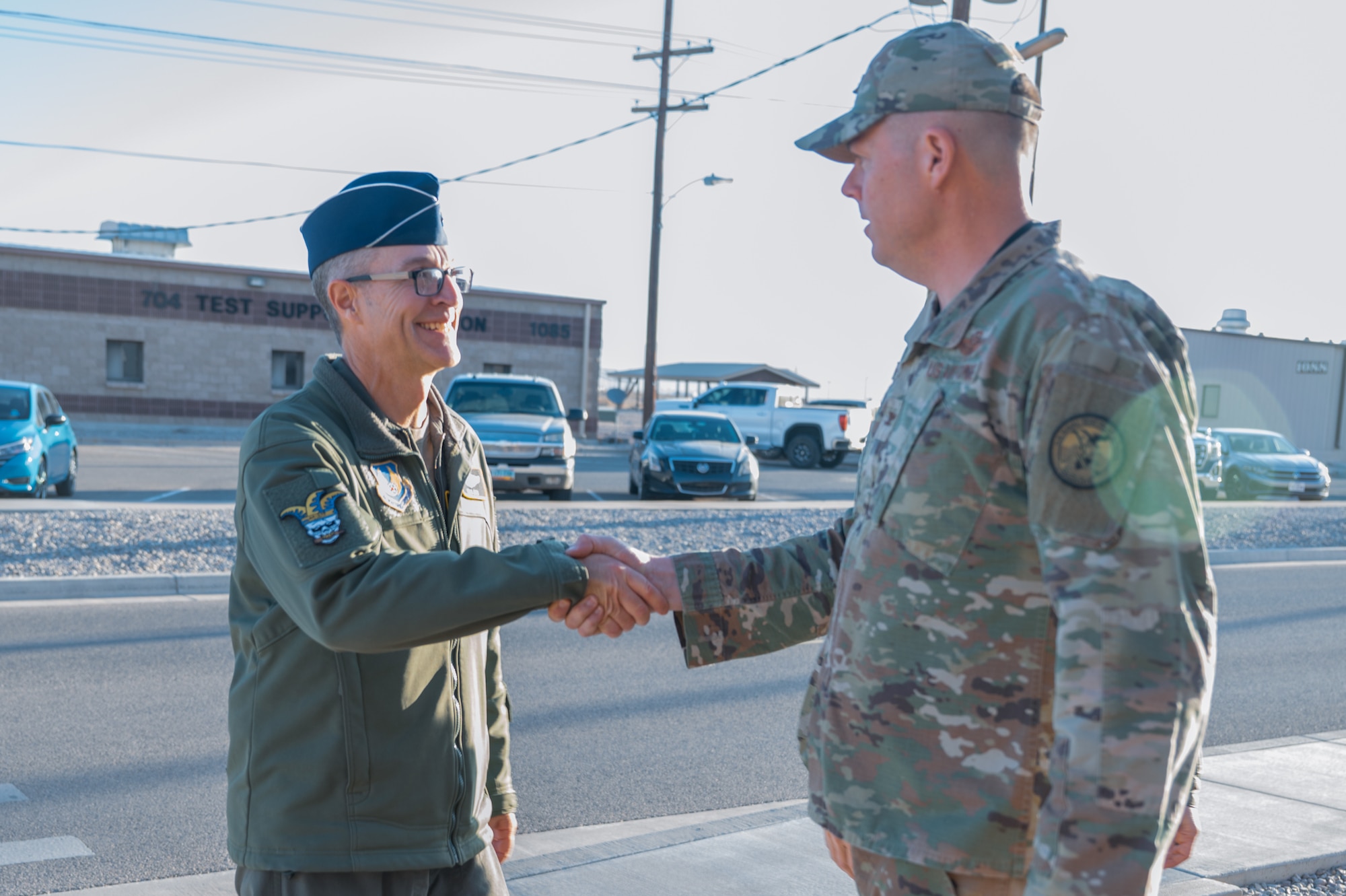 U.S. Air Force Maj. Gen. Scott Cain, Air Force Test Center commander, left, meets U.S. Air Force Col. Wayne Dirkes, 704th Test Group commander, during a visit at Holloman Air Force Base, New Mexico, March 21, 2025. Cain visited the 704th TG to discuss ongoing projects and go over suggestions for revitalizing current equipment. (U.S. Air Force photo by Airman 1st Class Bob Teichmann)