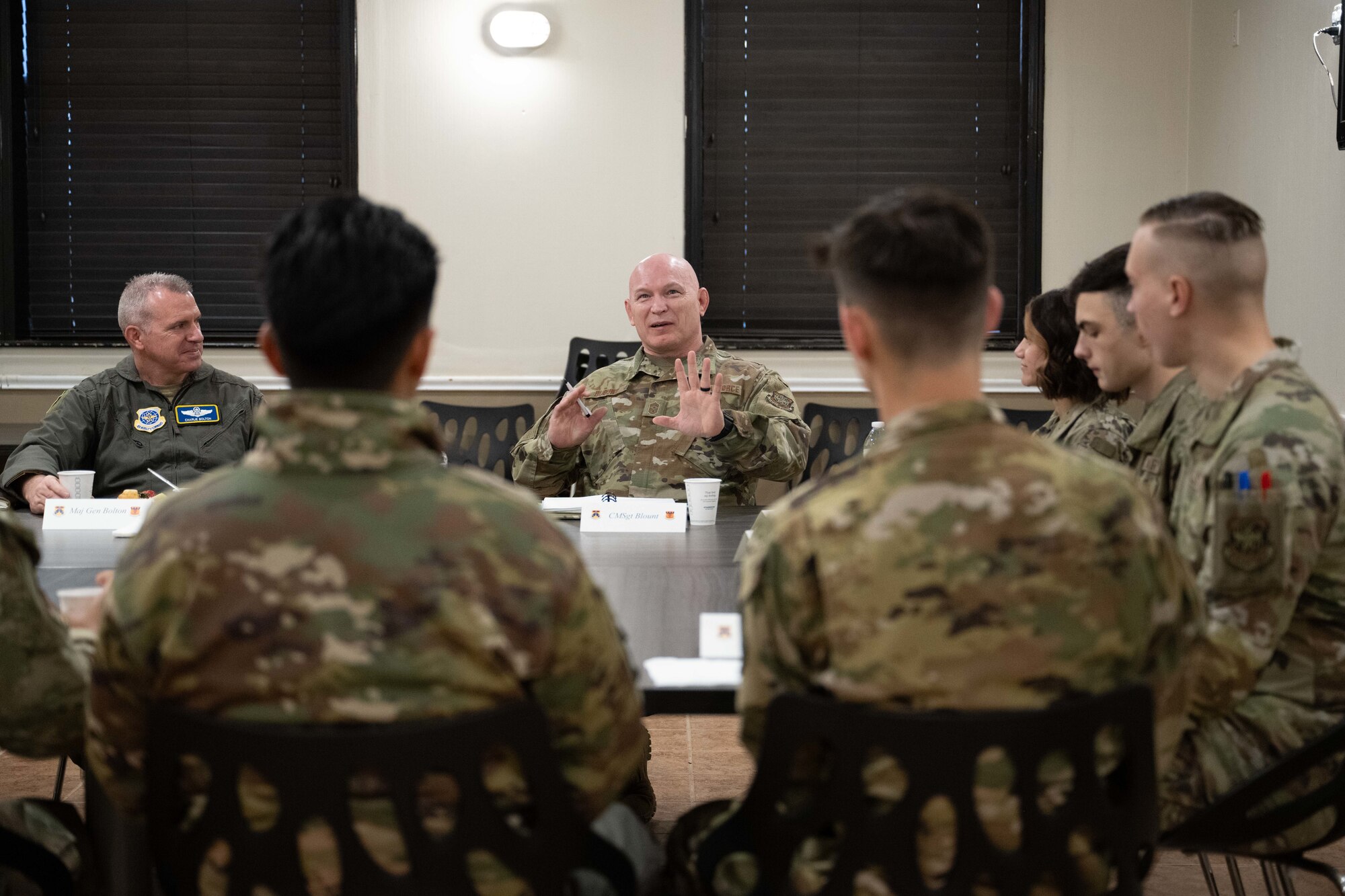 U.S. Air Force Maj. Gen. Charles Bolton, 18th Air Force commander, and Chief Master Sgt. Thomas Blount, 18th AF command chief, speak with Airmen assigned to the 317th Airlift Wing during an immersion visit breakfast at Dyess Air Force Base, Texas, April 2, 2025. The 18th AF command team spent the day meeting Airmen and touring various facilities to get a firsthand look at how the 317th AW is at the leading edge of tactical airlift. (U.S. Air Force photo by Airman Caleb Schellenberg)