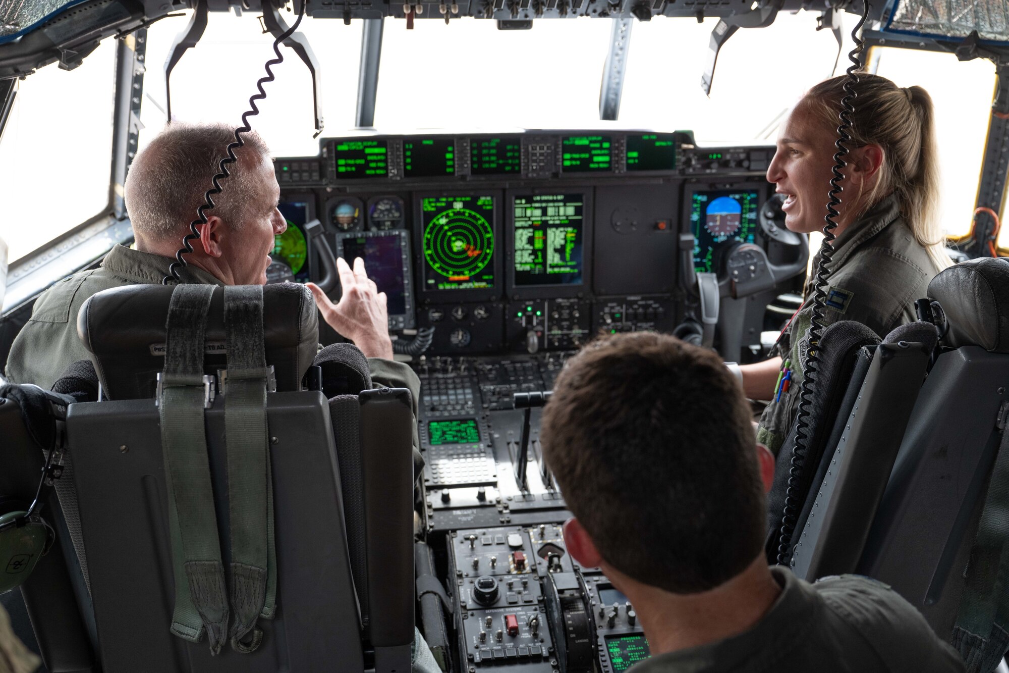 U.S. Air Force Maj. Gen. Charles Bolton, 18th Air Force commander, receives a briefing from Capt. Allyson Swift, 317th OSS Wing Tactics Chief, in the cockpit of a C-130J Super Hercules at Dyess Air Force Base, Texas, April 2, 2025. The 18th AF command team spent the day meeting Airmen and touring various facilities across the installation to observe how the 317th AW is at the leading edge of tactical airlift. (U.S. Air Force photo by Airman Caleb Schellenberg)