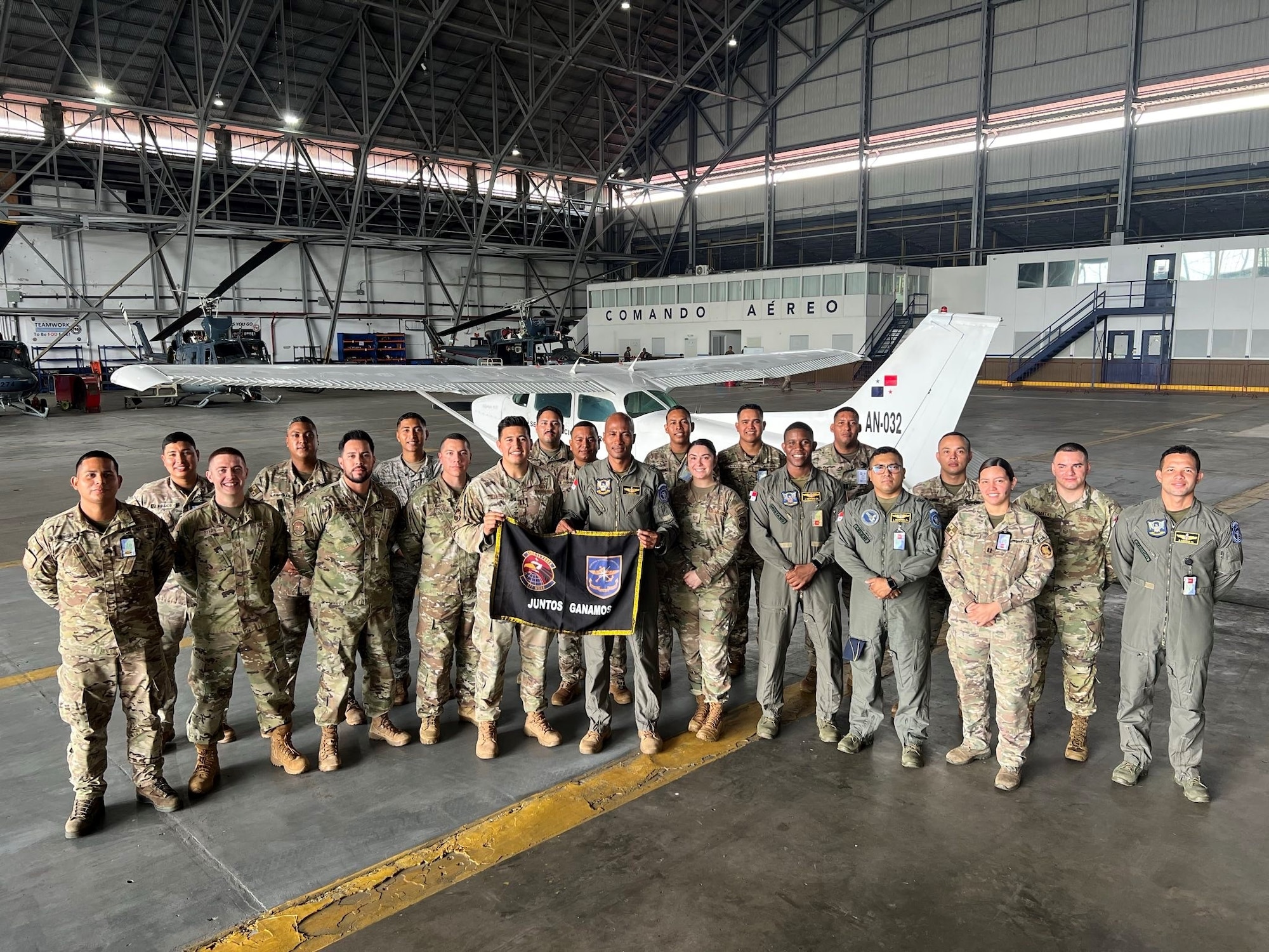 A group holds a flag.