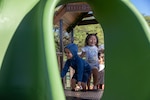 Preschoolers climb to the top as they explore their brand-new playground at the Pacific Missile Range Facility's (PMRF) Child Development Center (CDC).