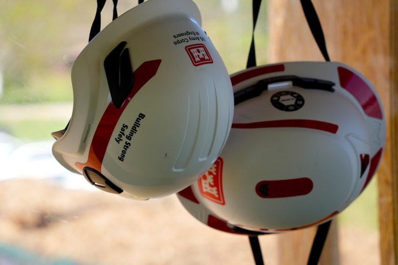 Two hard hats hang on a wall inside the U.S. Army Corps of Engineers’ debris load inspection tower at the Old Fort Debris Management Site in Old Fort, North Carolina, April 9, 2025. Corps staff stationed here oversee the debris tracking and reporting efforts for Hurricane Helene cleanup operations