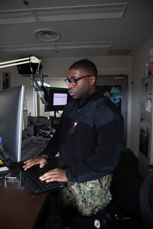 U.S. Navy Interior Communications Electrician 1st Class Nathan Cobb, a technical services manager with Armed Forces Network Iwakuni, Japan, and North Carolina native, checks a computer in the radio studio at AFN Iwakuni, Feb 6, 2025. Cobb routinely diagnoses and repairs radio and television broadcasting equipment at AFN Iwakuni to ensure Marines, Sailors and their dependents have uninterrupted access to American radio and television programing as well as command information and news from across the Department of Defense. (U.S. Marine Corps photo by Lance Cpl. Siwan Lewis)