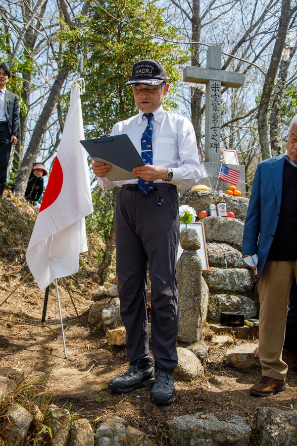 Fukao Hiroyuki, the U.S. participation coordinator for the Marukoyama Memorial Ceremony for the Marukoyama Memorial Ceremony, explains the sequence of events to the participants of the Marukoyama Memorial Ceremony before the start of the 80th anniversary ceremony in Kure City, Hiroshima Prefecture, Japan, April. 3, 2025. The Marukoyama Memorial Ceremony is held every year in Kure during cherry blossom season to honor the crew members of the U.S. Navy TBM-3 Avenger, Torpedo Squadron 6, who died in Kure City, Hiroshima Prefecture, Japan, on July 24, 1945. (U.S. Marine Corps photo by Sgt. Randall Whiteman)