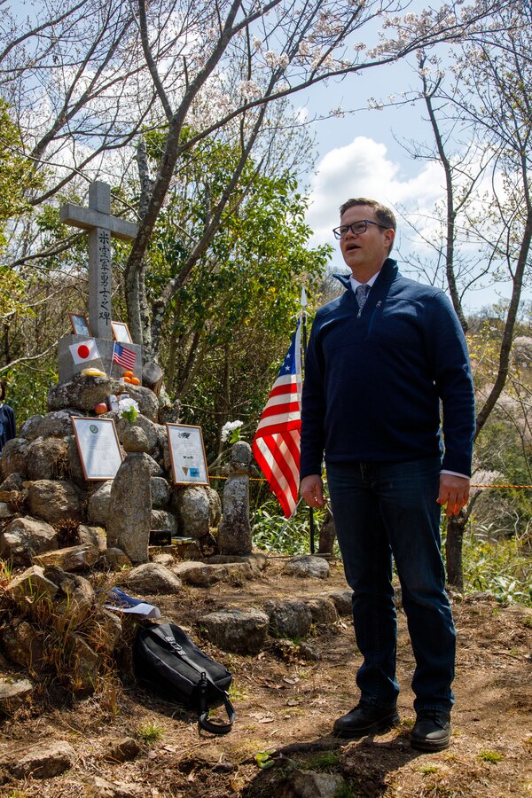 U.S. Navy Lt. John Pollnow, the Marine Corps Air Station Iwakuni duty command chaplain and a native of Wisconsin, sings the American National Anthem during the 80th anniversary of the Marukoyama Memorial Ceremony in Kure City, Hiroshima Prefecture, Japan, April. 3, 2025. The Marukoyama Memorial Ceremony is held every year in Kure during cherry blossom season to honor the crew members of the U.S. Navy TBM-3 Avenger, Torpedo Squadron 6, who died in Kure City, Hiroshima Prefecture, Japan, on July 24, 1945. (U.S. Marine Corps photo by Sgt. Randall Whiteman)
