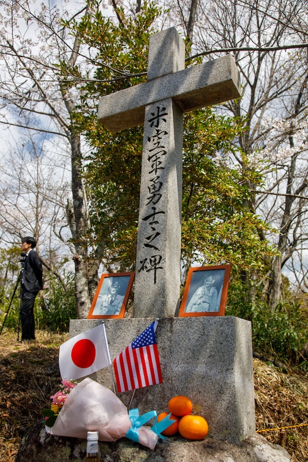 Gifts are left on a monument to fallen Americans by members of the Fujinowaki Neighborhood Association after the 80th anniversary of the Marukoyama Memorial Ceremony in Kure City, Hiroshima Prefecture, Japan, April. 3, 2025. The Marukoyama Memorial Ceremony is held every year in Kure during cherry blossom season to honor the crew members of the U.S. Navy TBM-3 Avenger, Torpedo Squadron 6, who died in Kure City, Hiroshima Prefecture, Japan, on July 24, 1945. (U.S. Marine Corps photo by Sgt. Randall Whiteman)