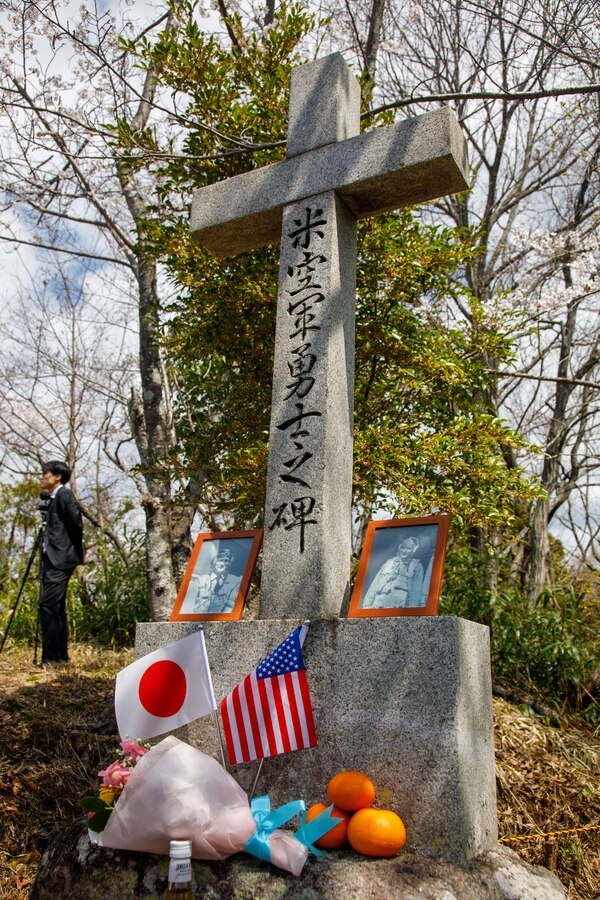 Gifts are left on a monument to fallen Americans by members of the Fujinowaki Neighborhood Association after the 80th anniversary of the Marukoyama Memorial Ceremony in Kure City, Hiroshima Prefecture, Japan, April. 3, 2025. The Marukoyama Memorial Ceremony is held every year in Kure during cherry blossom season to honor the crew members of the U.S. Navy TBM-3 Avenger, Torpedo Squadron 6, who died in Kure City, Hiroshima Prefecture, Japan, on July 24, 1945. (U.S. Marine Corps photo by Sgt. Randall Whiteman)