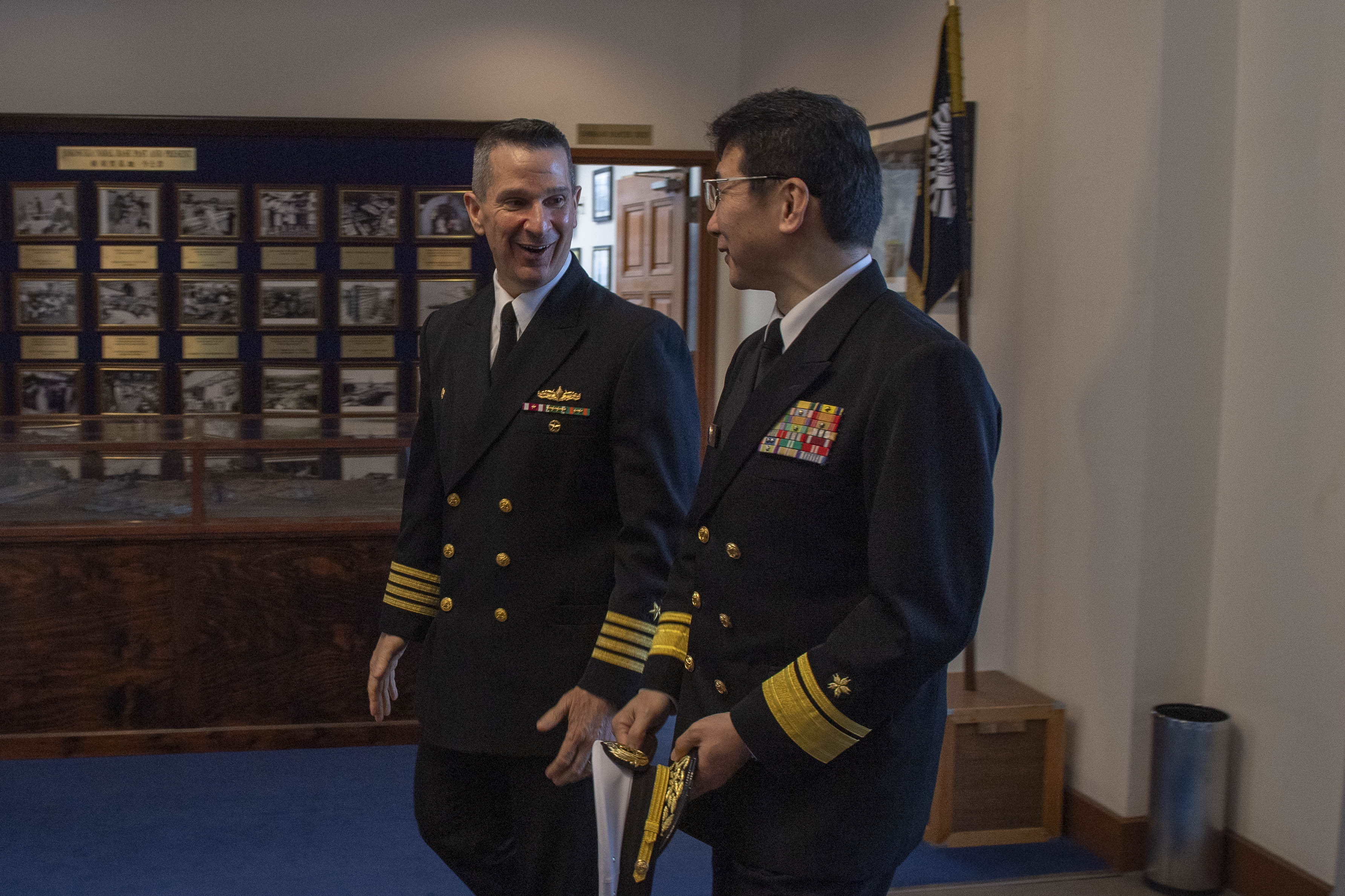 Capt. Les Sobol, Commander, Fleet Activities Yokosuka (CFAY), welcomes Japan Maritime Self-Defense Force (JMSDF) Rear Adm. Nobuhisa Yamaguchi, chief of staff for JMSDF, Yokosuka District, in the installation commanding officer’s office at CFAY headquarters.