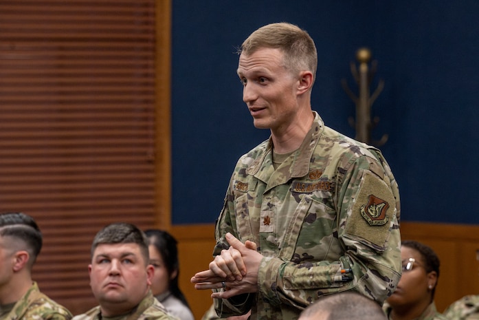 U.S. Air Force Maj. Evan Dicks, 35th Civil Engineer Squadron engineer flight commander, asks Lt. General Stephen Jost, U.S. Forces Japan and Fifth Air Force commander, a question during a mentorship briefing.