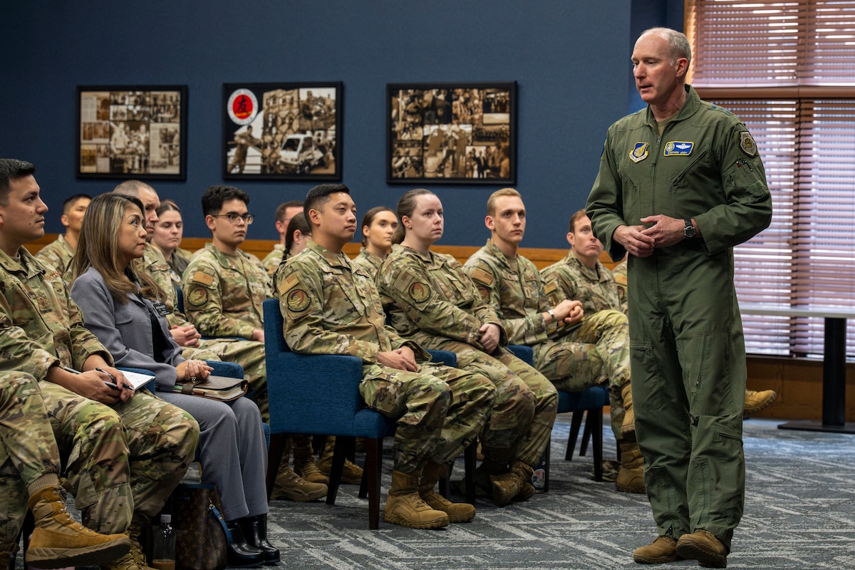U.S. Air Force Lt. General Stephen Jost, right, U.S. Forces Japan and 5th Air Force commander, speaks to a crowd of officers and senior noncommissioned officers during a mentorship briefing.