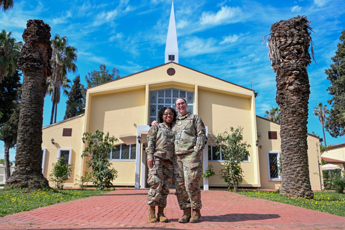 U.S. Air Force Senior Airmen Demarshae Faulkner and Ashley Young, 39th Air Base Wing Religious Affairs journeymen, pose for a photo in front of the Chapel at Incirlik Air Base, Türkiye, April 4, 2025. Religious Affairs Airmen offer guidance, compassion to service members, helping them to navigate the personal and professional challenges of military life. (U.S. Air Force photo by Senior Airman Haiden Morris)