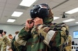 Airmen from the 166th Airlift Wing participate in a readiness exercise at Fort Indiantown Gap, Pennsylvania, on April 4, 2025. The Airmen demonstrated high standards of efficiency and readiness through various tasks, including field navigation tests, searching for unexploded ordnance, assembling and disassembling weapons, and donning Mission-Oriented Protective Posture gear. (U.S. Air National Guard photo by Airman Austin Stern)