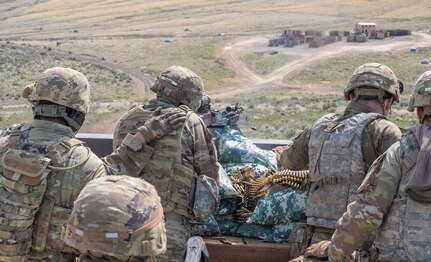 A weapons squad from 2nd Battalion, 162nd Infantry Regiment fires an M240 machine gun from a support-by-fire position during a blank-fire iteration at Yakima Training Center, Wash., April 5, 2025.