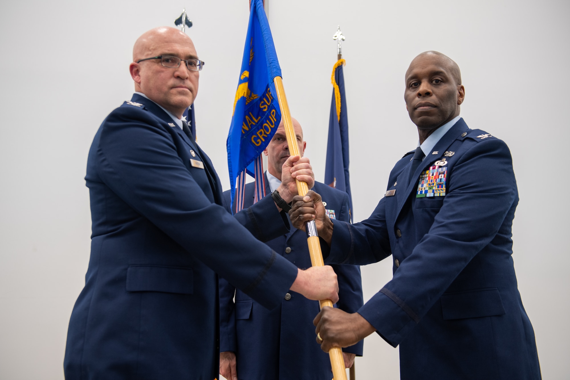 Col. Marvin Laing receives the guidon from Col. Robert Noren, 193rd Special Operations Wing commander, during an assumption of command ceremony for the 193rd Regional Support Group at Fort Indiantown Gap, Pennsylvania, April 12, 2025.