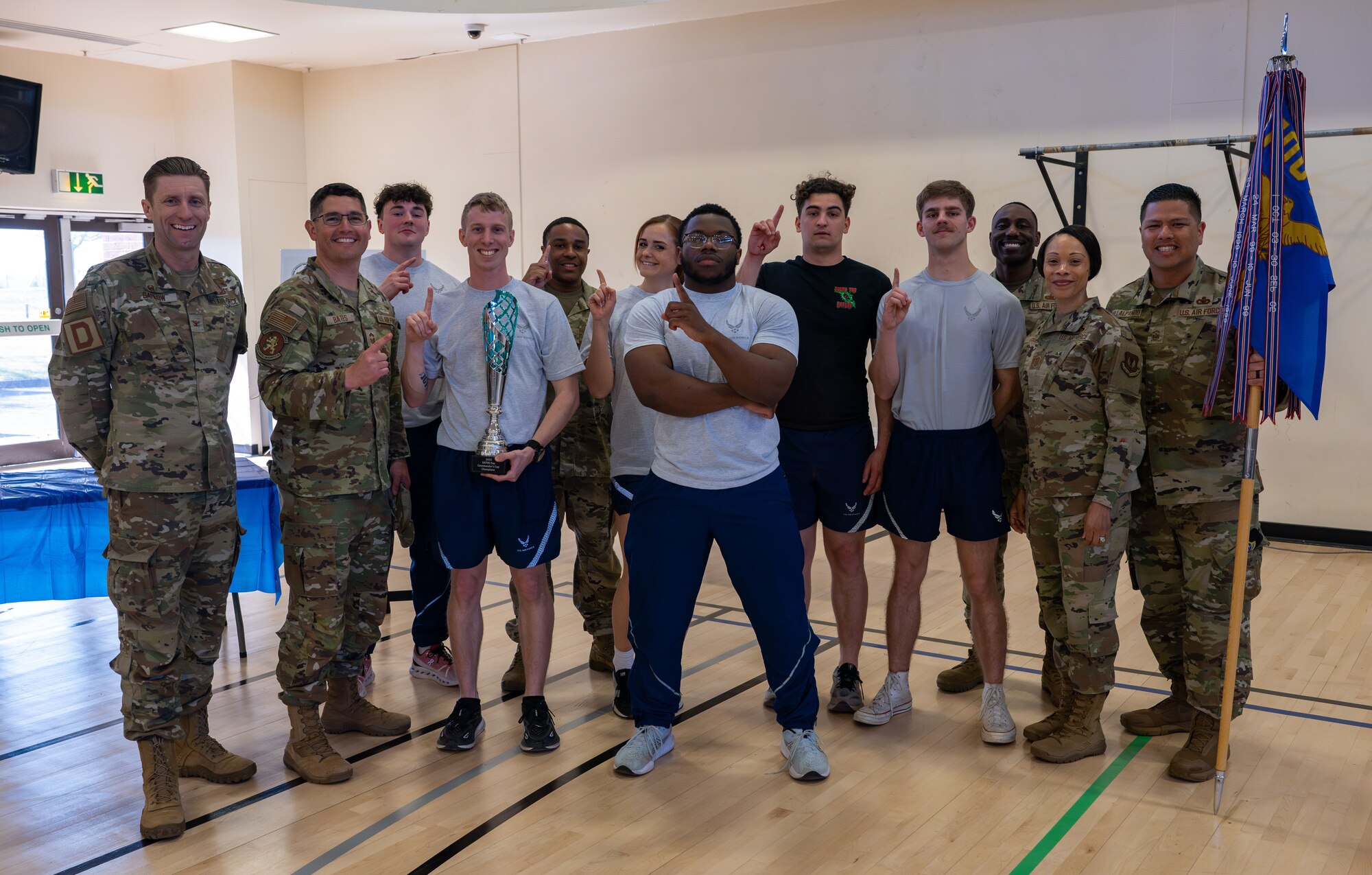 U.S. Air Force 100th Logistics Readiness Squadron members pose for a photo with the 100th Air Refueling Wing command team after winning the Commander’s Cup during the SAFER Resilience Day event at RAF Mildenhall, England, April 11, 2025.