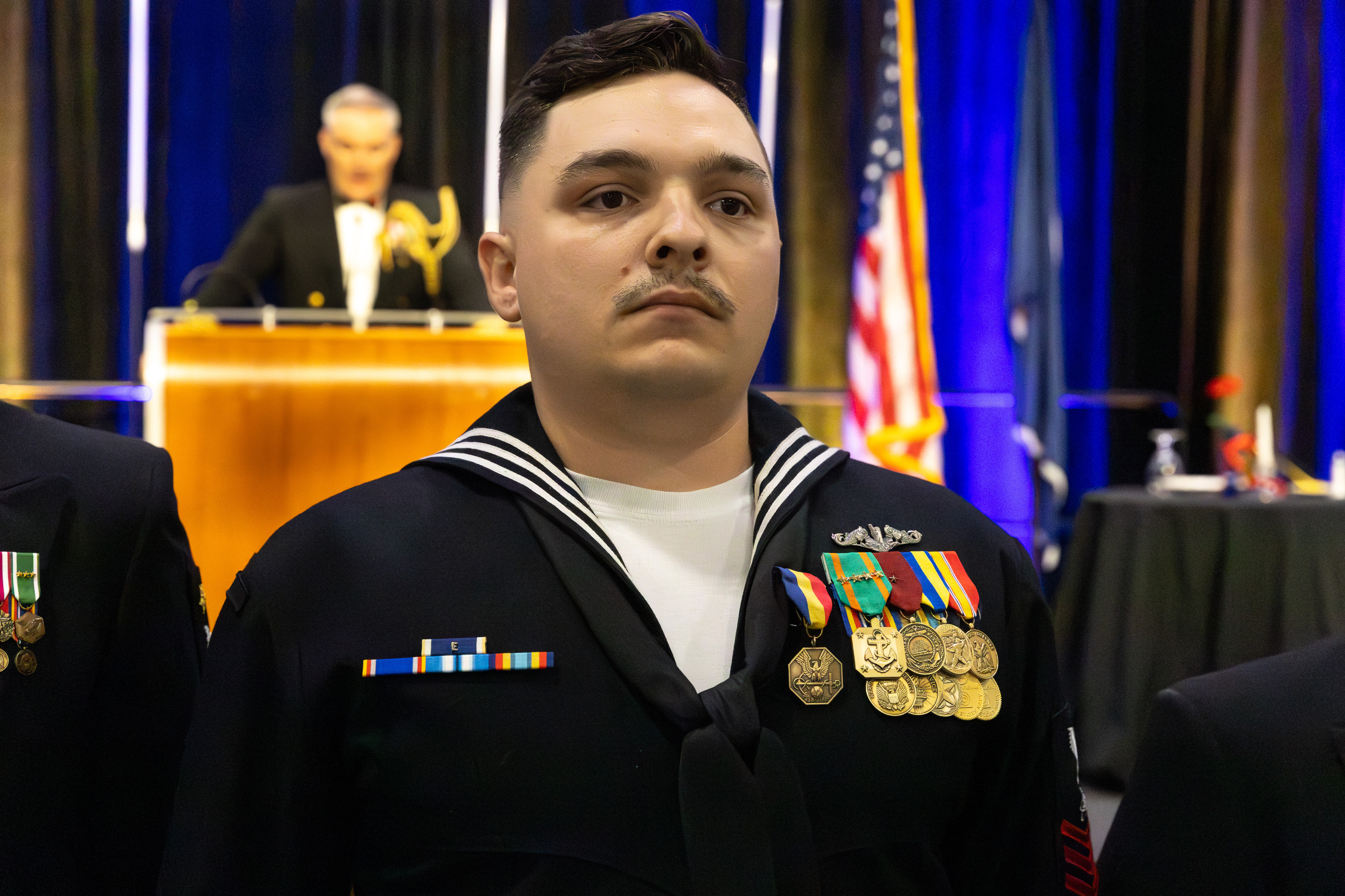 ETN1 Journey stands at attention during his official presentation of the Navy and Marine Corps Medal.