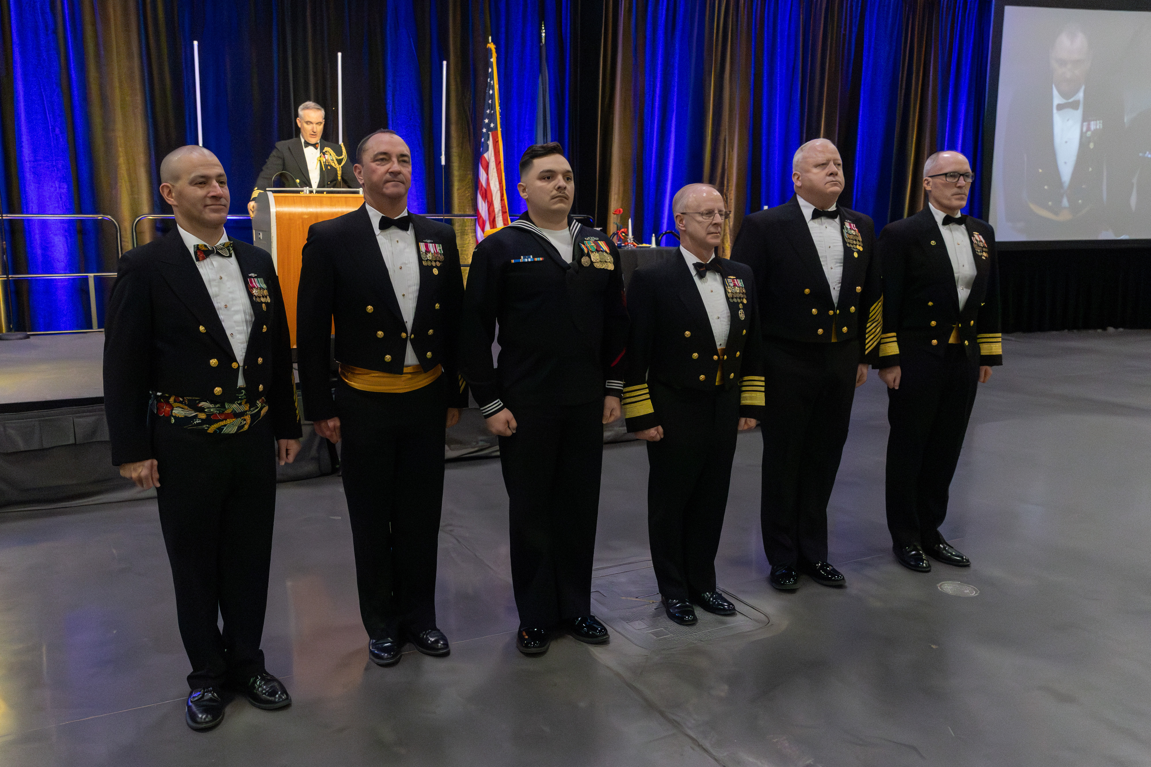 Command leadership from Comander, U.S. Fleet Forces Command and Commander, Submarine Force, Master Chief Petty Officer of the Navy stand alongside ETN1 Journey during the presentation of the Navy and Marine Corps. Medal to Journey.