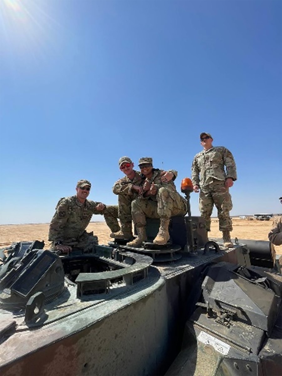 Airmen pose for photo.
